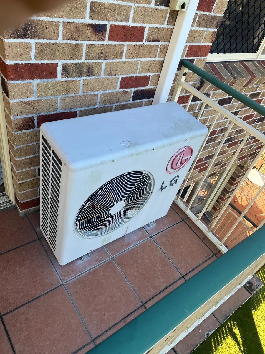 Aged outdoor condenser before replacement